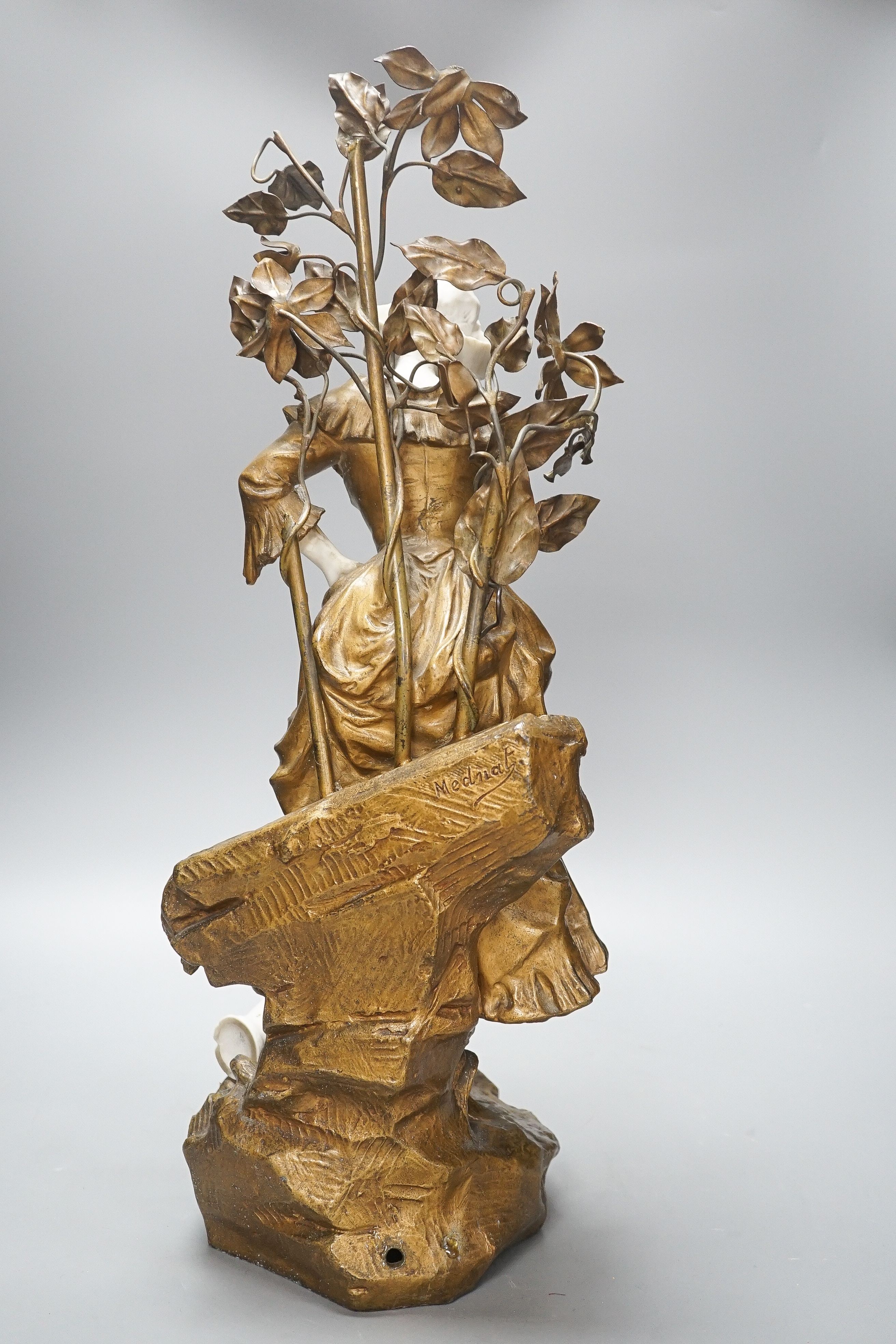 A late 19th Century French gilt spelter and bisque porcelain figure after Mednat 54cm